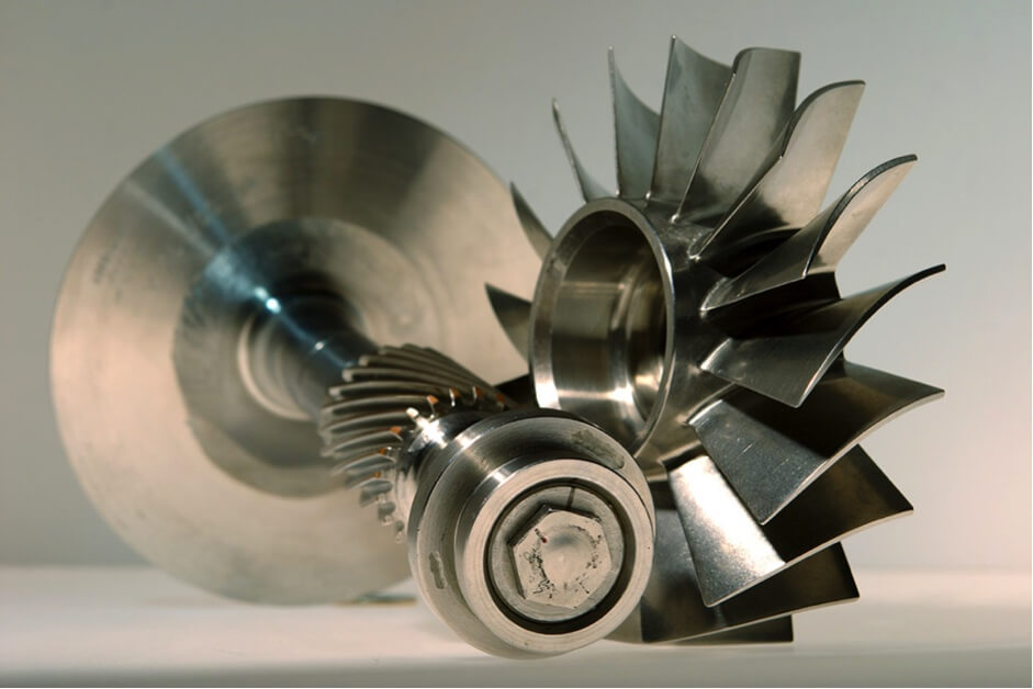 Collage of titanium parts in real-world applications: aerospace components, medical implants, and marine hardware, demonstrating versatility of titanium in high-performance industries