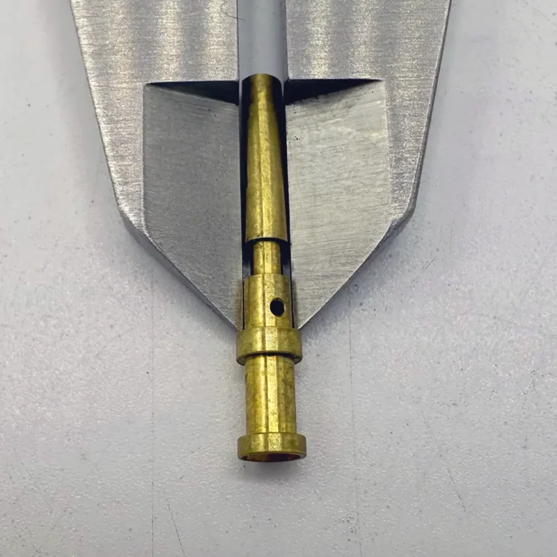 Precision shaft made of brass, CNC machined with a drilled hole, suitable for use in high - end mechanical devices.