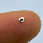 Micro fastener made of stainless steel, precisely CNC machined, perfect for miniature mechanical assemblies.