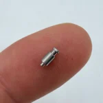 Micro - sized pin - like component made of stainless steel via CNC machining, suitable for compact electronic devices.