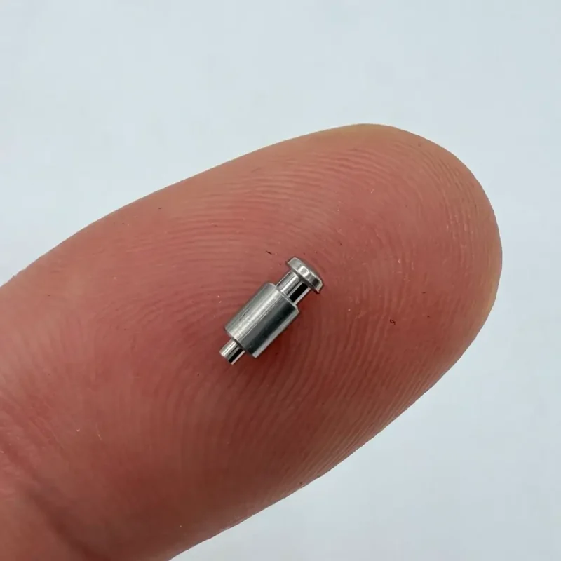 Micro - sized pin - like component made of stainless steel via CNC machining, suitable for compact electronic devices.