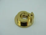 Single gold CNC machined precision component with detailed structure